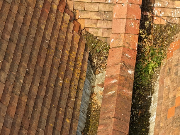 Vegetation blockage in valley gutter